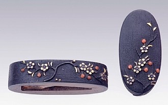 Fuchi and Kashira (Sword Hilt Accessories) 

Plum Tree 

Goto School 

Shakudo, gold, and coral inlay, nanako (dots) background 

First half of 19th c. 

Fuchi: 3.8 cm, Kashira: 3.5 cm