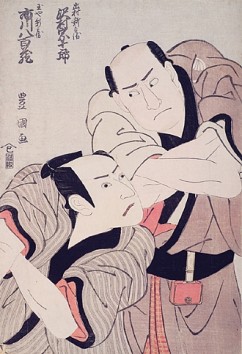 Kabuki Actors Sawamura Sojuro III and Ichikawa Yaozo III as Izumura  Shinnosuke and Tamaya Shinnosuke in the Play "Tomiyoka koi no Yamabiraki", performed in the Kiri Theatre in 1798 

Utagawa Toyokuni (1769-1825) 

Signature: Toyokuni ga 

Publisher: Iwaya 

Oban, woodblock colour print 

1798 

37.3 x 25.3 cm