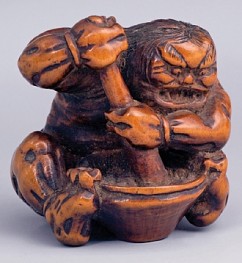 קאטאבורי נטסקה, אוני (שד) מכין מוצ'י (עיסת אורז) 

חתימה: מיטסונאו 

עץ 

המחצית הראשונה של המאה ה־19 

גובה: 3.6 ס"מ