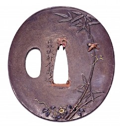 Tsuba (Sword Handguard) 

Bamboo and Flowers 

Signature: Chikujoken Mototoshi, Mito School 

Shibuichi (copper and silver alloy), gold and silver 

Copper and shakudo (copper, bronze and gold alloy) inlay 

Second quarter of the 19th c. 

6.5 x 5.8 cm