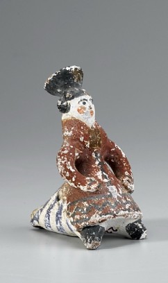 Whistle designed as woman with hat