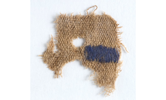 Wool textile fragment with a purple-blue band dyed