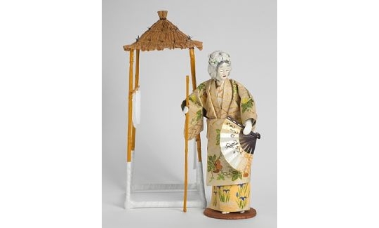 Komachi Leaning on a Staff in Front of her Hu