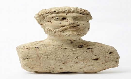 Bearded man with moustache and long hair, wearing